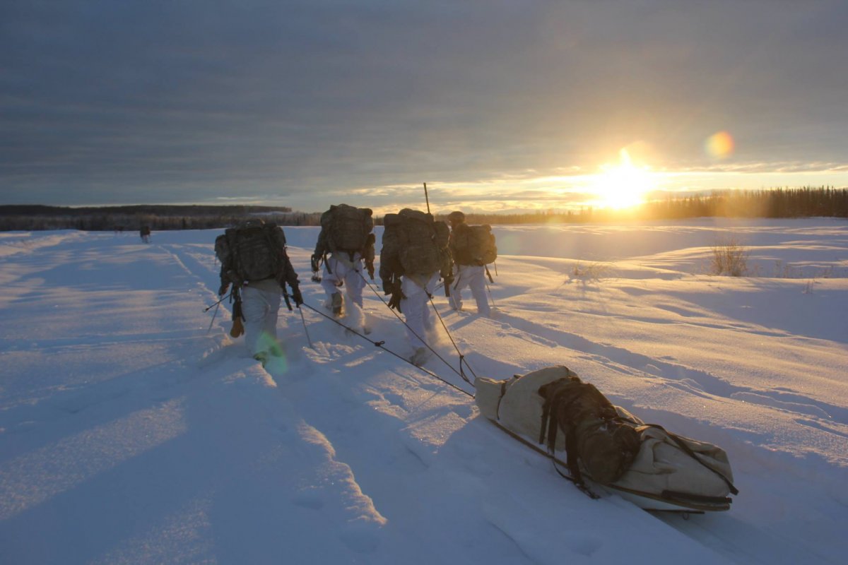 soliders hiking in the snow