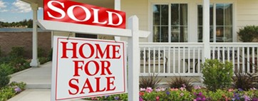 Home for Sale sign with sold on top