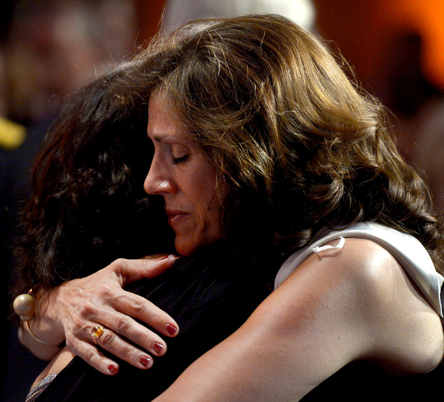 two ladies comforting each other