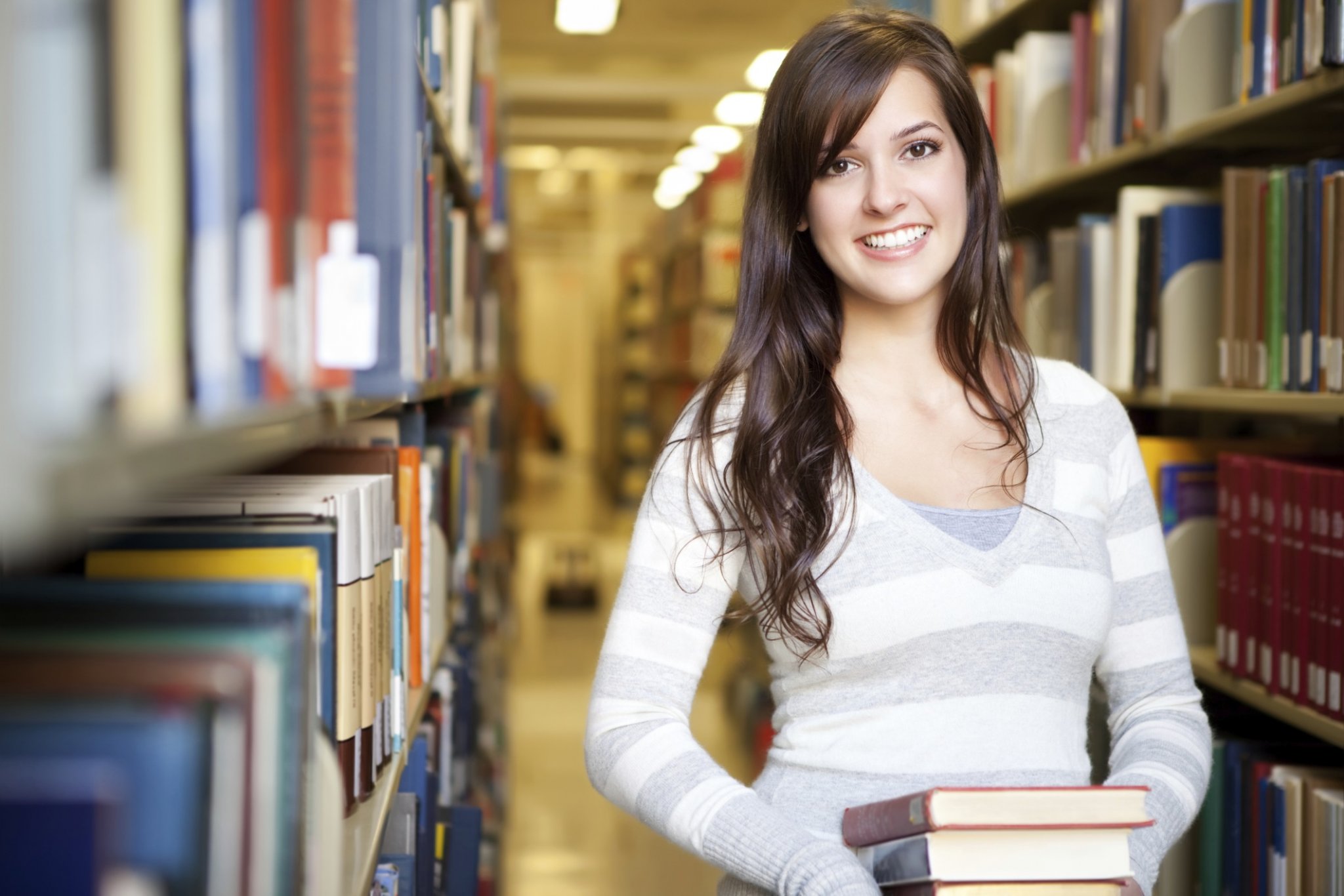 lady standing in a library
