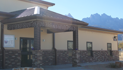 A building with a mountain in the background