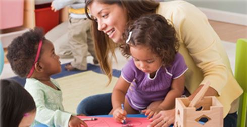 teacher at a daycare with kids