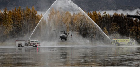 Helicopter being sprayed with water