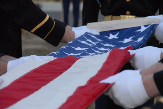 Honor Guard burial ceremony folding the american flag