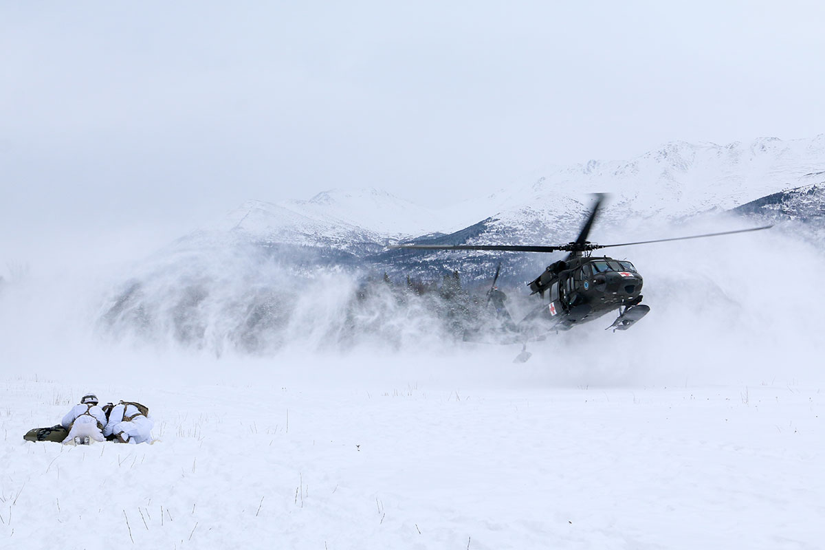 helicopter taking off from the snow