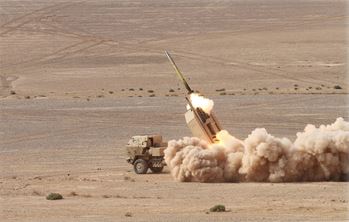 Missile being fired from a vehicle