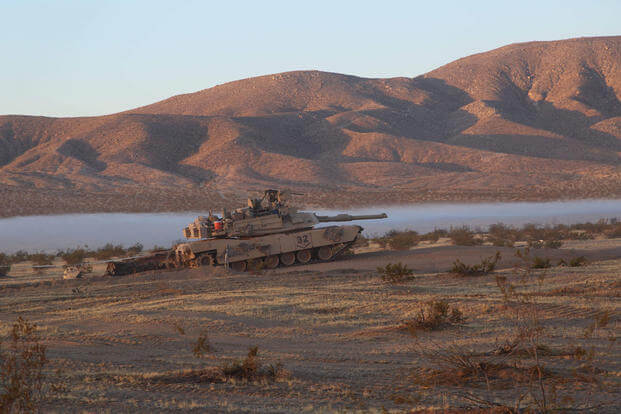 tank next to a lake