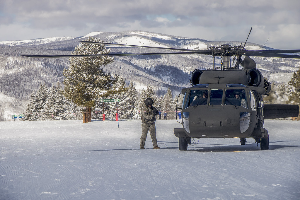 helicopter taking off from the snow