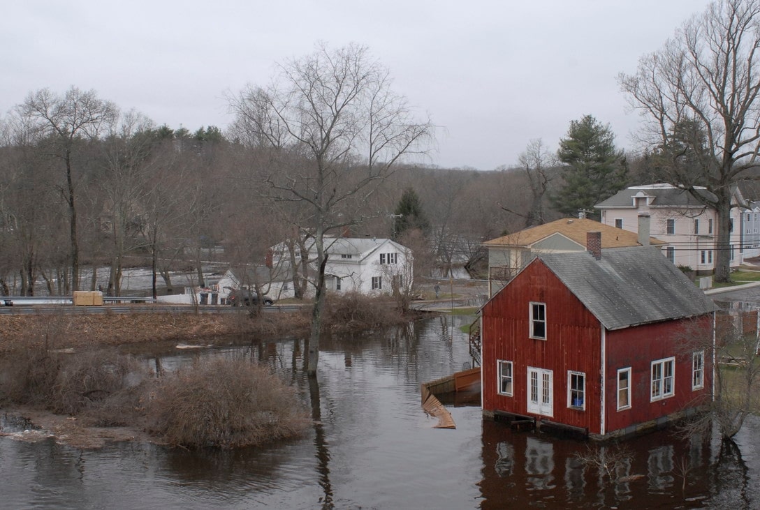 houses surrounded by flood water