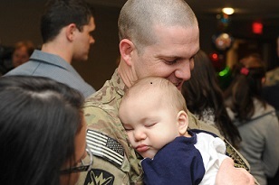 Soldier holding his baby