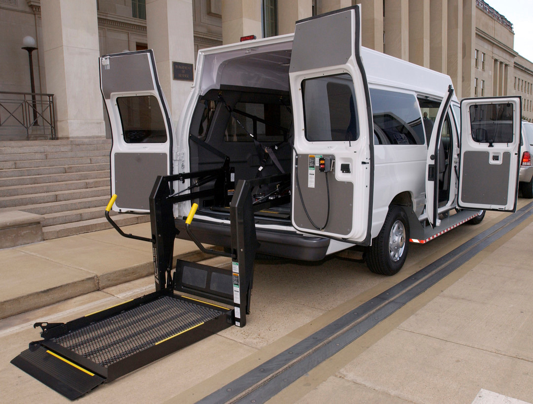 white van with wheelchair lift ramp out the back