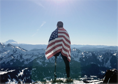 Disabled vet standing on top of a mountain