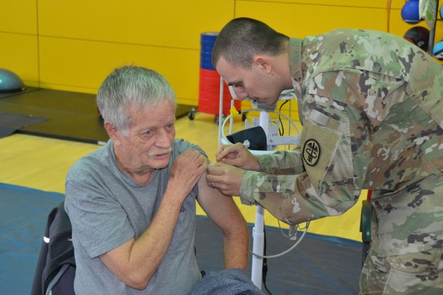 Veteran getting blood presure checked