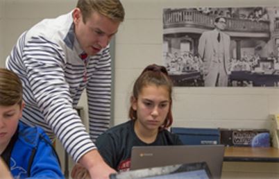 teacher giving instruction to a student