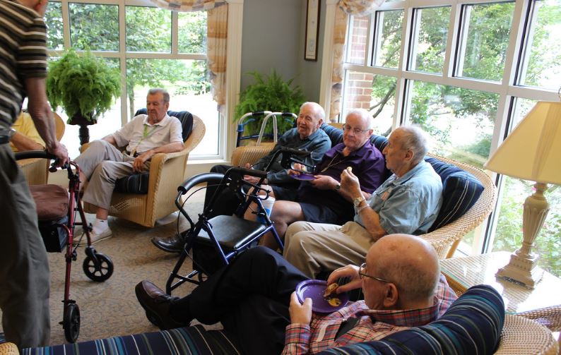 verterans in a veterans home sitting on a couch