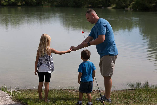 father and kids fishing