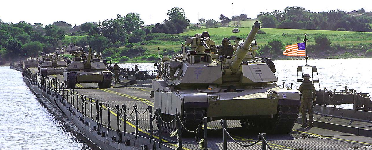 tanks driving over a bridge