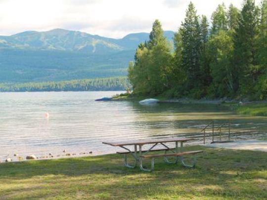 Lake with mountains in background