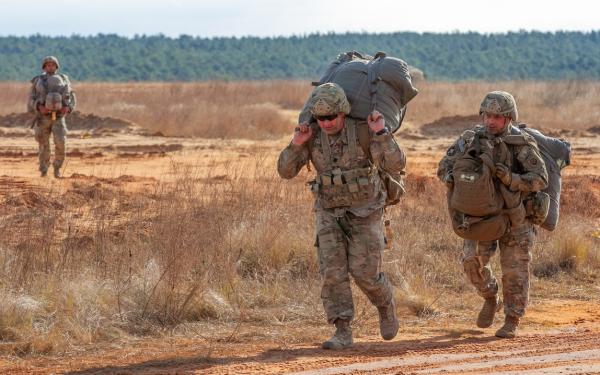 soldier carrying supplies