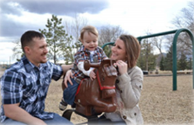 famly of 3 at the playground