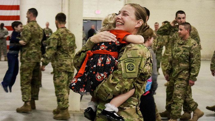 Soldier holding child